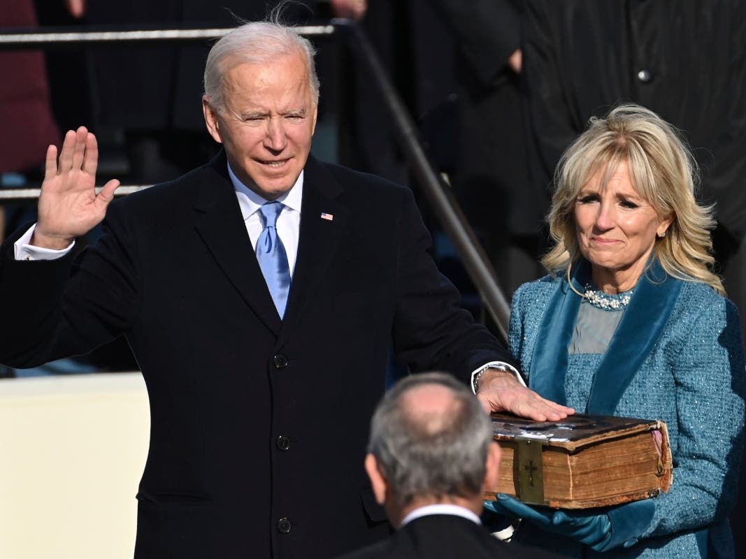 Joe Biden is sworn in as the 46th president of the United States by Chief Justice John Roberts as Jill Biden holds the Bible during the 59th Presidential Inauguration at the U.S. Capitol in Washington, Wednesday, Jan. 20, 2021.