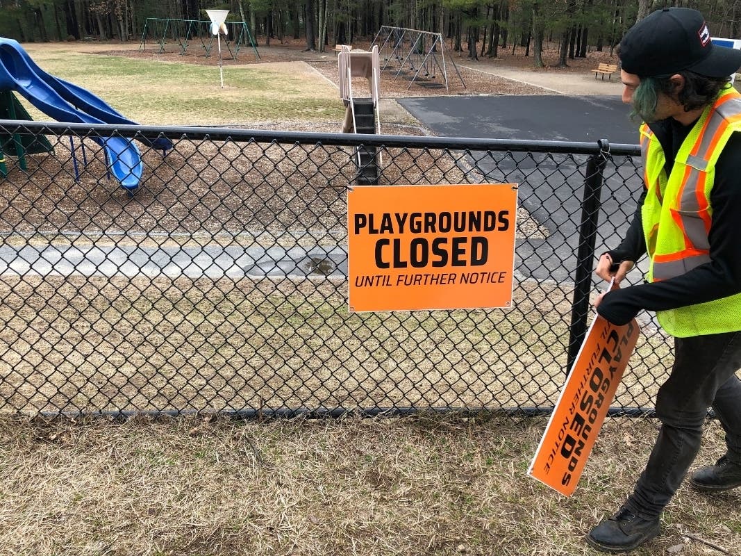 A closed sign is placed near an entrance to a playground at an elementary school in Walpole, Massachusetts, March 20, out of concern about the spread of the coronavirus. 