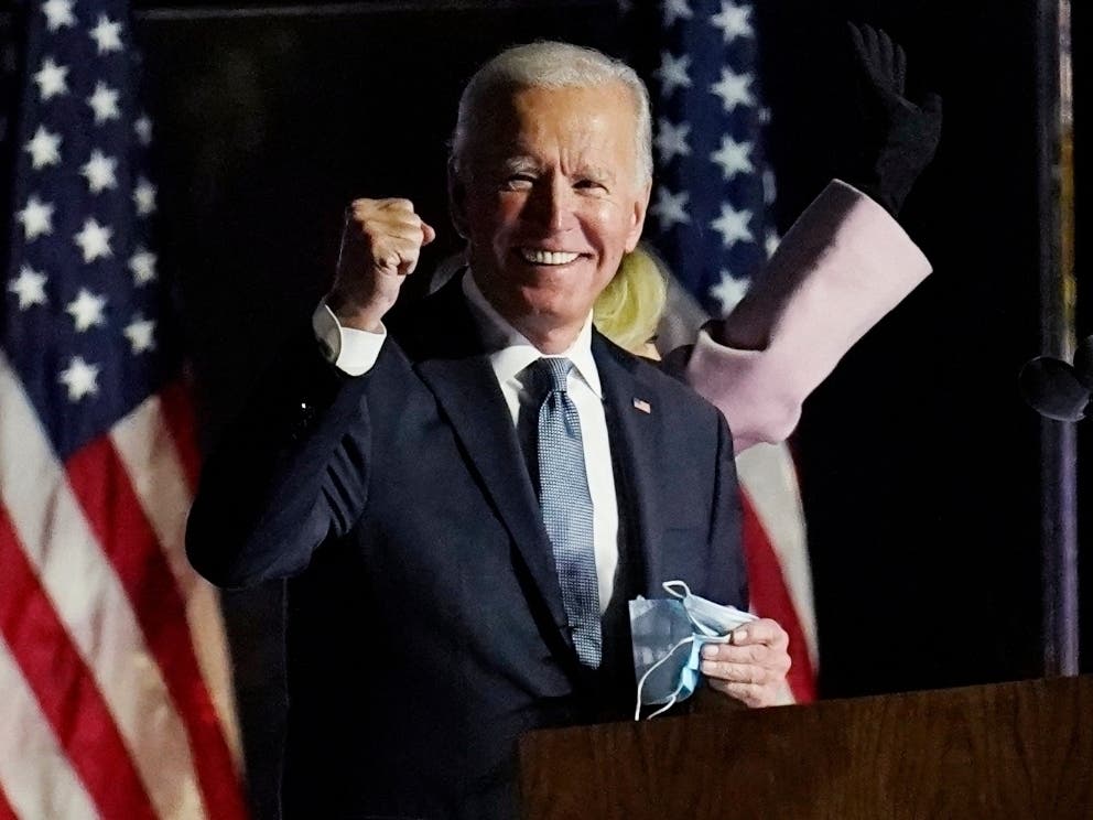 Cheers boomed through downtown Atlanta Saturday after Joe Biden was declared president-elect. Others protested for President Trump.