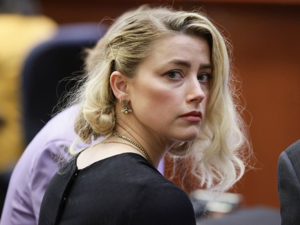 Actor Amber Heard waits before the verdict was read at the Fairfax County Circuit Courthouse in Fairfax, Va, June 1, 2022. The jury awarded Johnny Depp more than $10 million in his libel lawsuit against ex-wife Amber Heard.