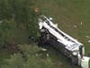 Emergency personnel work the scene of a deadly crash on Tuesday, May 14, 2024 in Marion County. The Florida Highway Patrol says a bus carrying farmworkers overturned, killing several people and injuring over 40 more when a pickup truck sideswiped it.