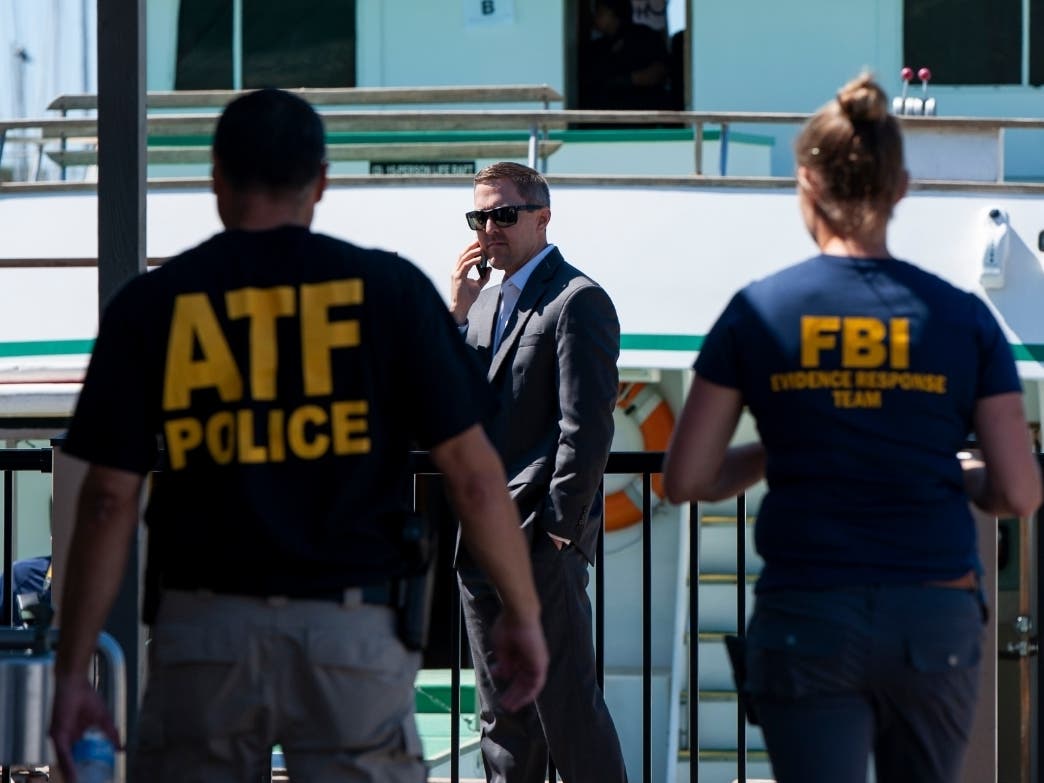 Authorities work to investigate the Truth Aquatics office on the Santa Barbara Harbor in Santa Barbara, Calif., Sunday, Sept. 8, 2019. Authorities served search warrants Sunday at the company that owned the scuba diving boat that caught fire.
