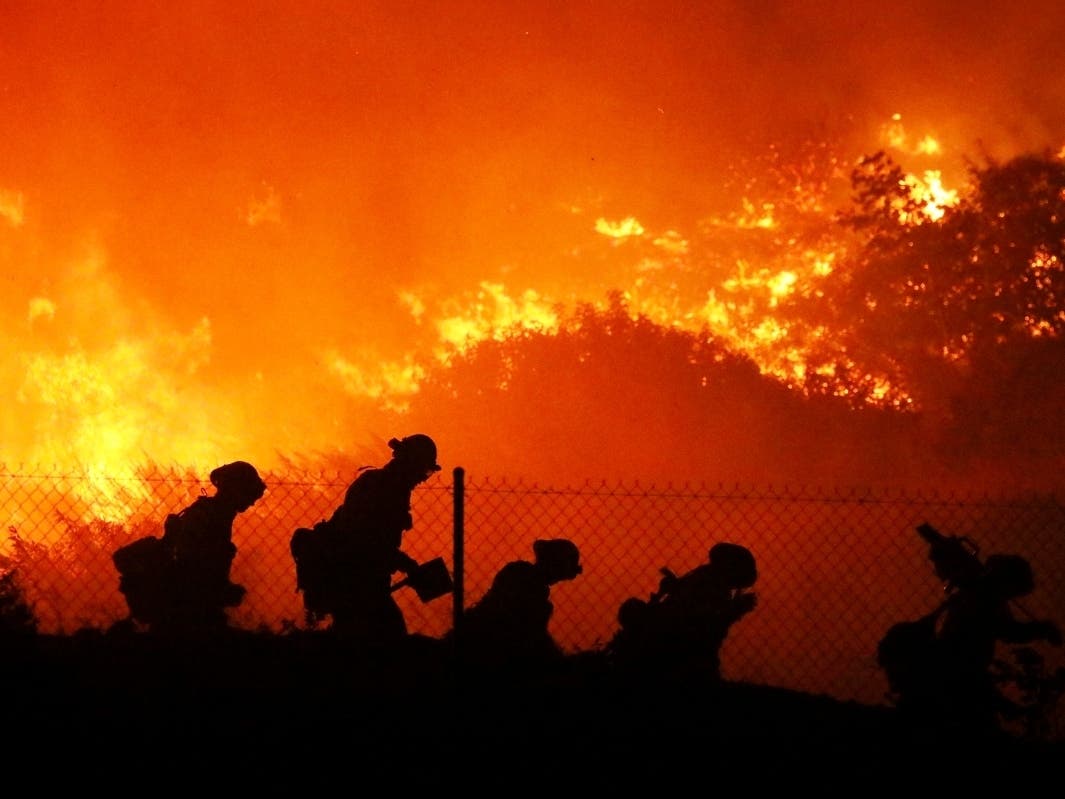 Firefighters battle the Saddleridge fire in Sylmar, Calif., Friday Oct. 11, 2019