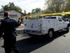 Investigators drive towards the house of the suspected gunman who opened fire at Saugus High School on Thursday in Santa Clarita, Calif. 
