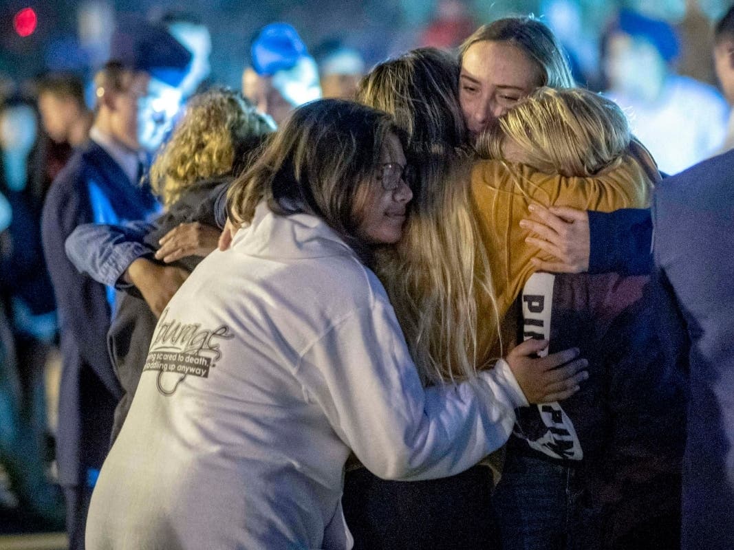 Mourners hug during a vigil for the Saugus High School shooting victims at Central Park, Thursday, Nov. 14, 2019, in Santa Clarita, Calif. Los Angeles County sheriff’s officials say a 16-year-old student shot several classmates and then himself.