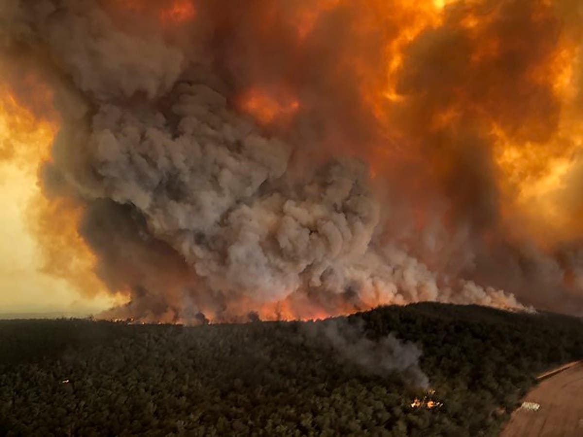 Wildfires rage under plumes of smoke Dec. 30 in Bairnsdale, Australia. 