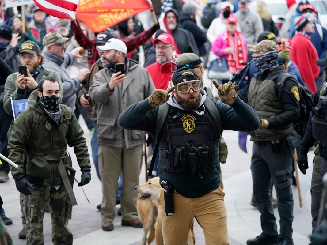 In this Jan. 6, 2021, file photo, Trump supporters gather outside the Capitol in Washington. As rioters converged on the U.S. Capitol building, the grounds normally hailed as the seat of American democracy became a melting pot of extremist groups. 