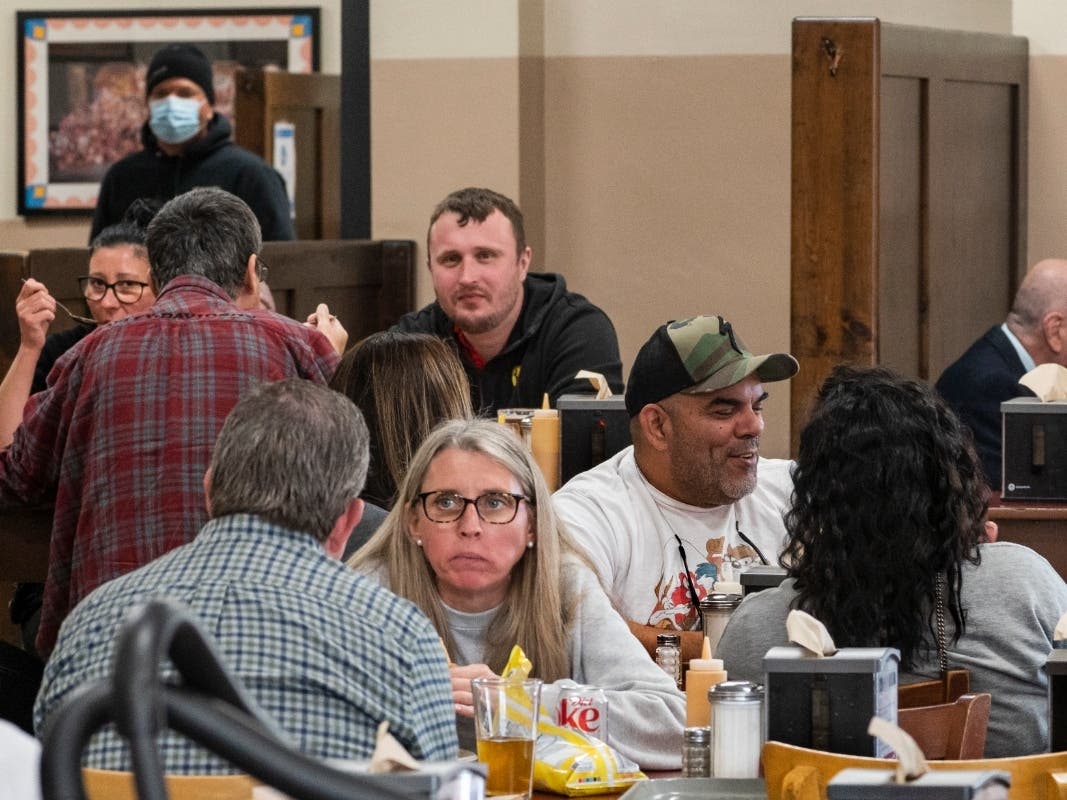 Patrons eat indoors at Philippe the Original restaurant in Los Angeles, Friday. Feb. 25, 2022. Los Angeles County is set to lift its indoor mask mandate this week as coronavirus case rates and hospitalizations plummet.