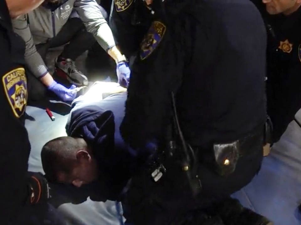 In this image taken from a nearly 18-minute video taken by a California Highway Patrol sergeant, Edward Bronstein, 38, is taken into custody by CHP officers in 2020, following a traffic stop. Lawyers say California will pay a $24 million to his family.