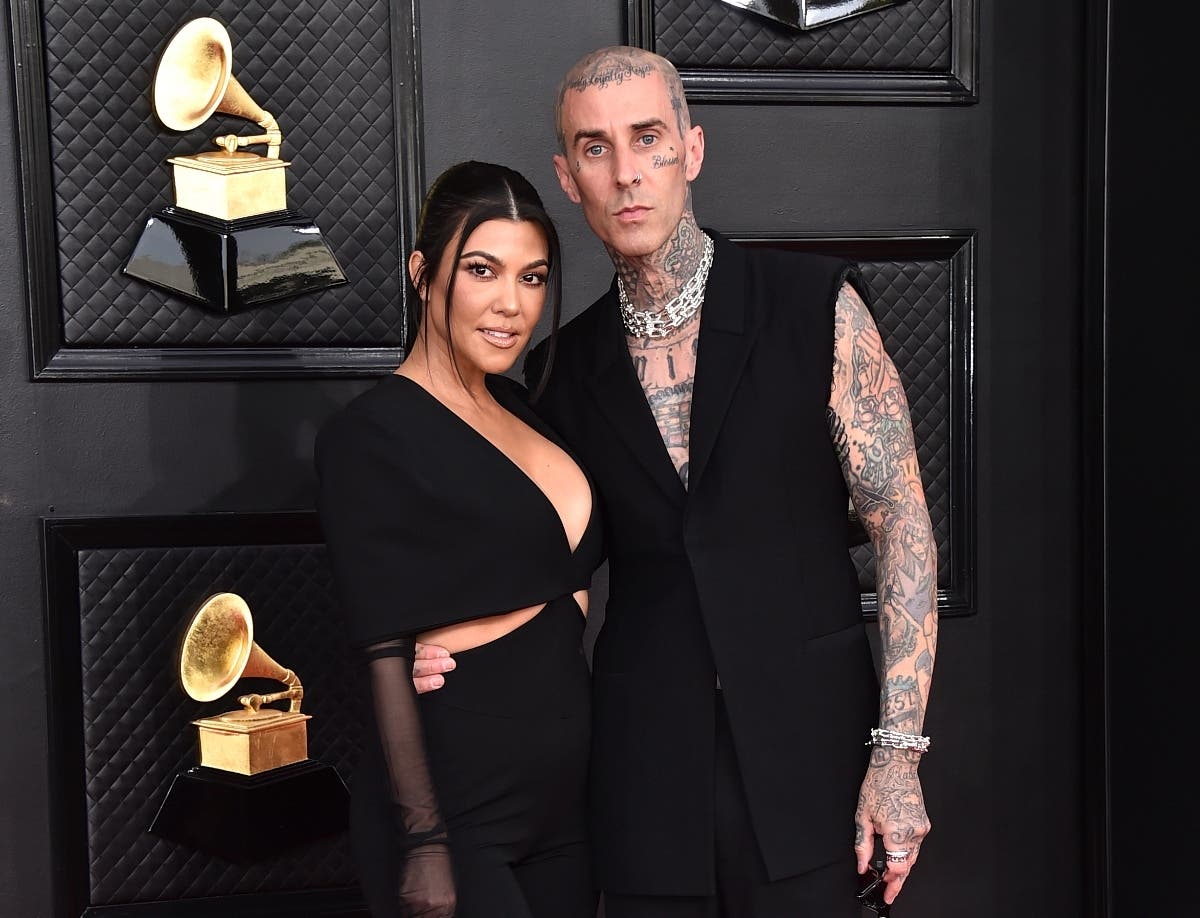 Kourtney Kardashian, left, and Travis Barker at the 64th Annual Grammy Awards in Las Vegas on April 3, 2022. 