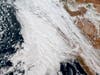 This GOES-West GeoColor composite satellite image taken at 5:30 p.m. EST, Wednesday, Jan. 31 2024, and provided by The National Oceanic and Atmospheric Administration (NOAA), shows an atmospheric river storm moving over California.