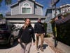 FBI agents walk door to door to try to speak with neighbors as members of the media follow them, Sunday near an address in Torrance, Calif., connected to Cole Tomas Allen, who was identified as the shooting suspect at the White House Correspondants Dinner