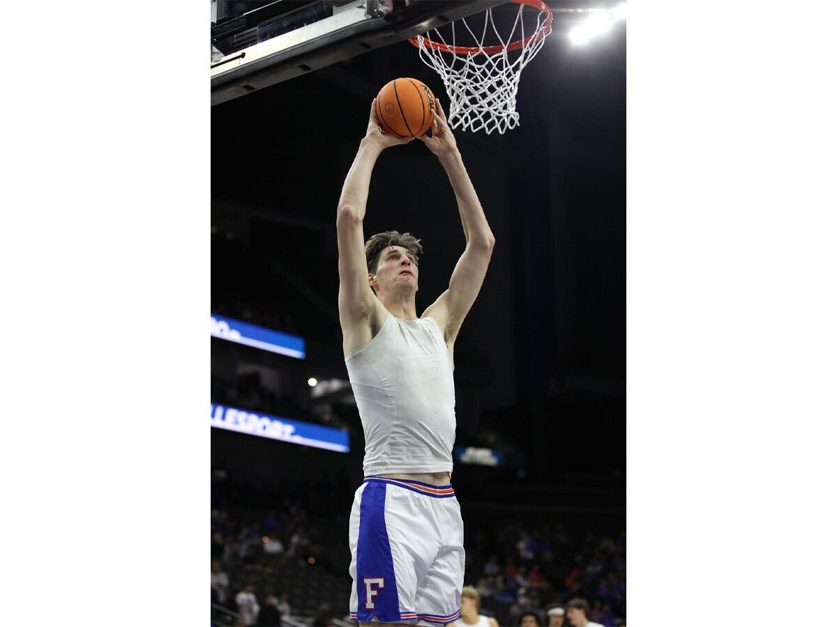 Olivier Rioux, (32), goes to the basket as he warms up before Florida takes on Miami during an NCAA college basketball game on Nov. 16, 2025, in Jacksonville, Fla. 