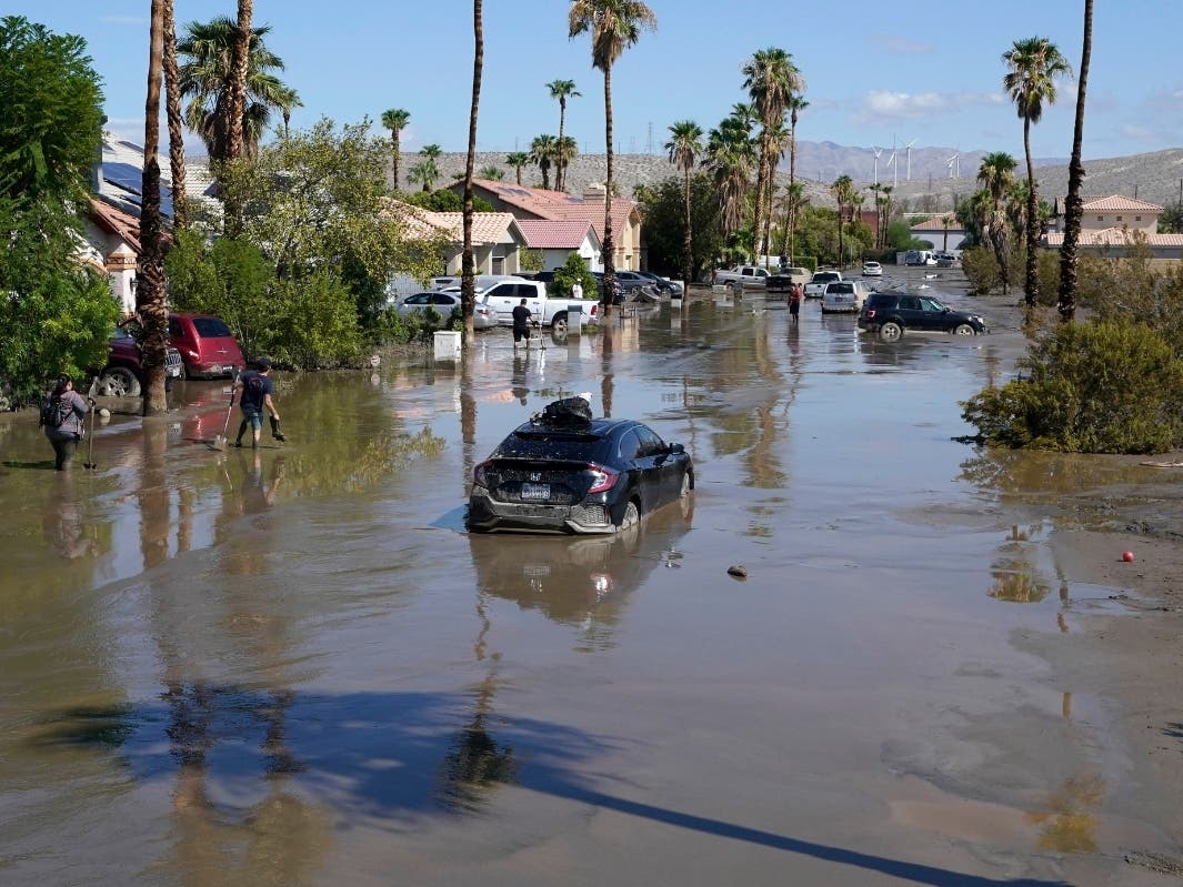 Cars are seen stuck in the mud following Tropical Storm Hilary on a street Aug. 21, 2023, in Cathedral City, Calif.