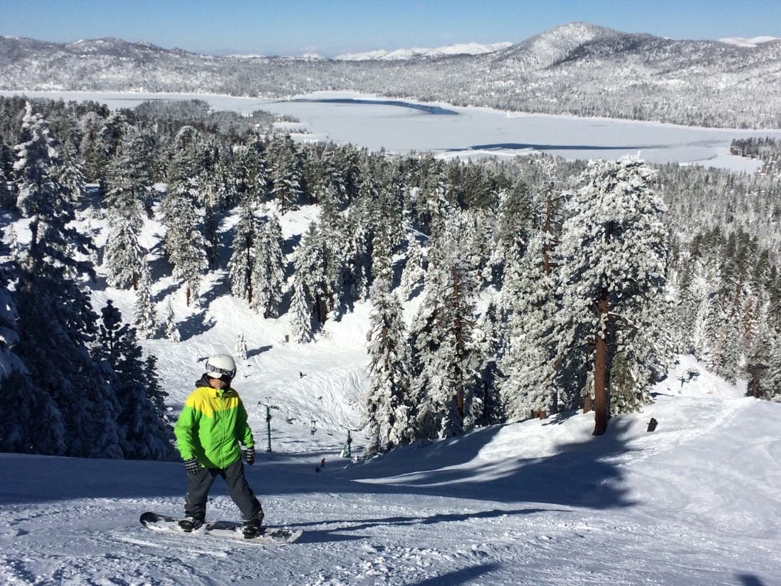 A snowboarder kicks off a run at Snow Summit in Big Bear Lake, Calif., Friday, Jan. 8, 2016, a day after El Nimo storms moved out leaving behind nearly two feet of fresh snow.