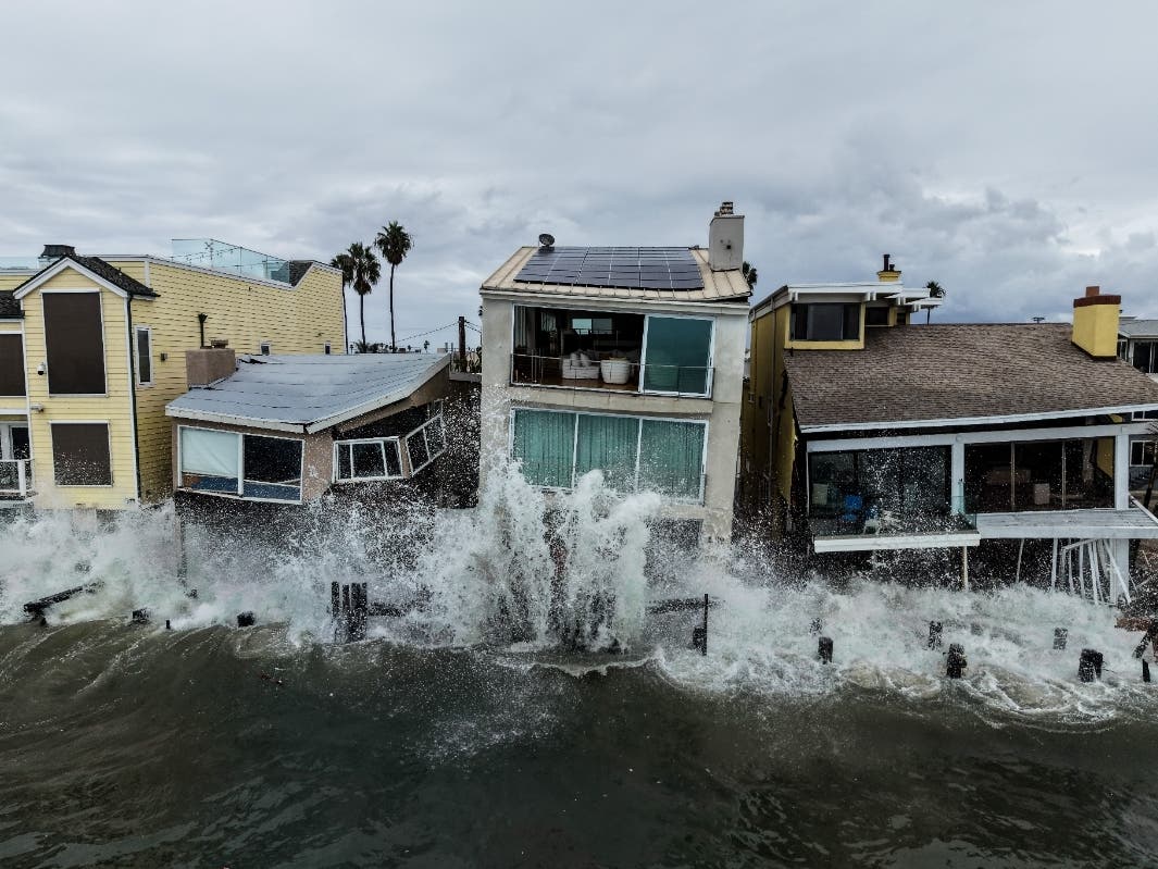 Waves from post-tropical cyclone Rachel crash into beachfront homes in Long Beach, Calif., Monday, Oct. 12, 2026.
