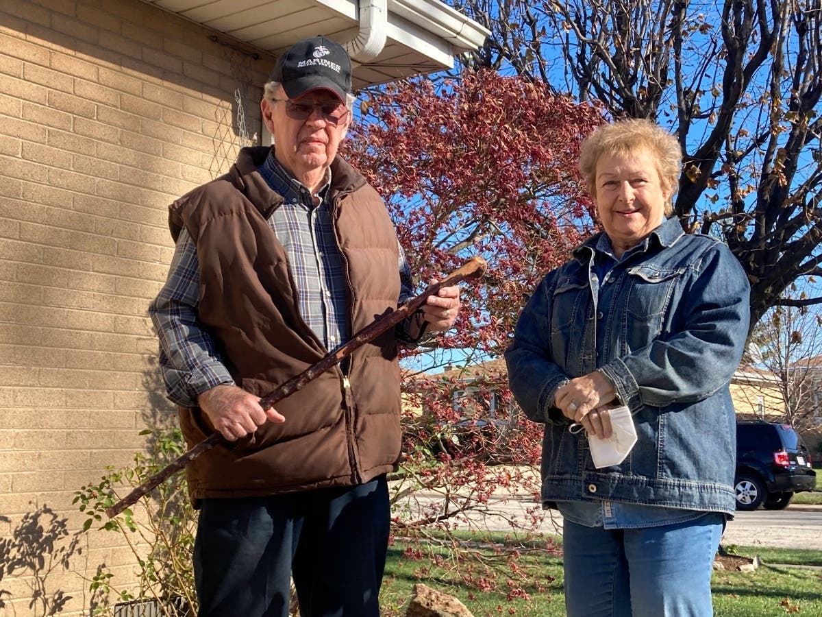 Dan Donovan, joined by his wife, Barbara, holds the antique shillelagh he used to chase burglars from the couple's Niles home even hitting one of the men in the back of the head on Tuesday.
