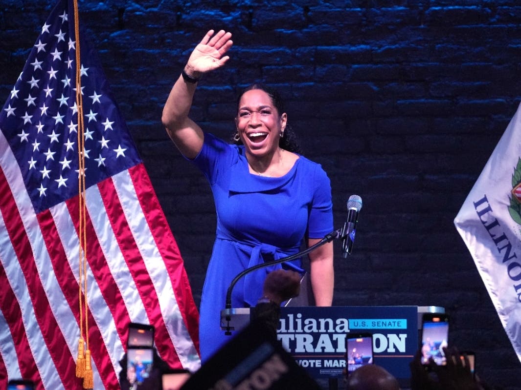 Illinois Lt. Gov. Juliana Stratton waves during a primary election night watch party after winning the Democratic primary for U.S. Senate Tuesday in Chicago.