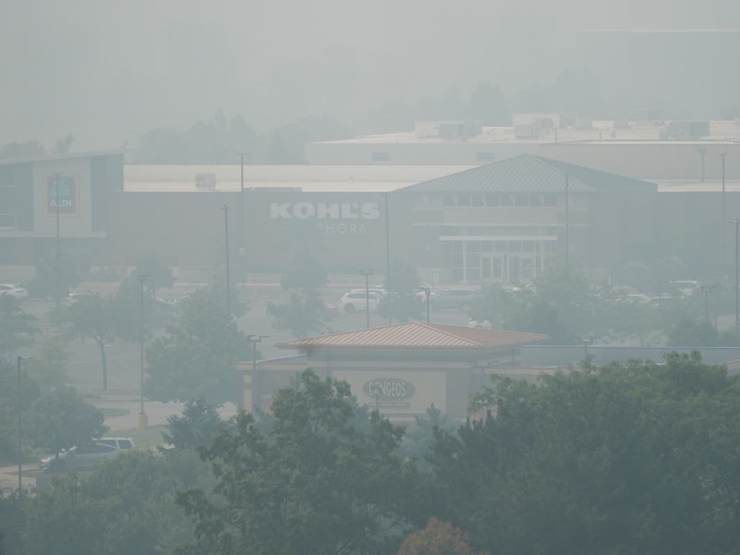 The Illinois EPA is maintaining air quality alerts across the area through Friday night. A general view a shopping center during poor air quality due to dense smoke from Canadian wildfires in Glenview.