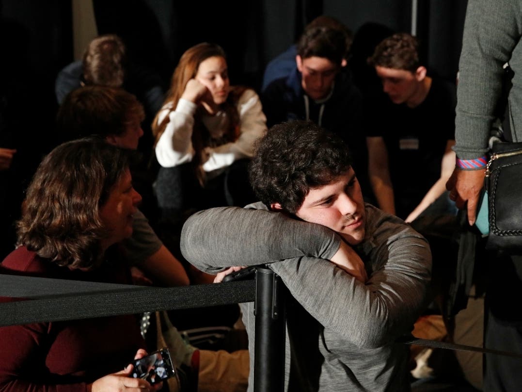 Democratic White House hopefuls left Iowa without knowing who won the state's first-in-the-nation presidential preference caucuses Monday after the release of results was delayed. Above, former Vice President Joe Biden's supporters wait for the results.