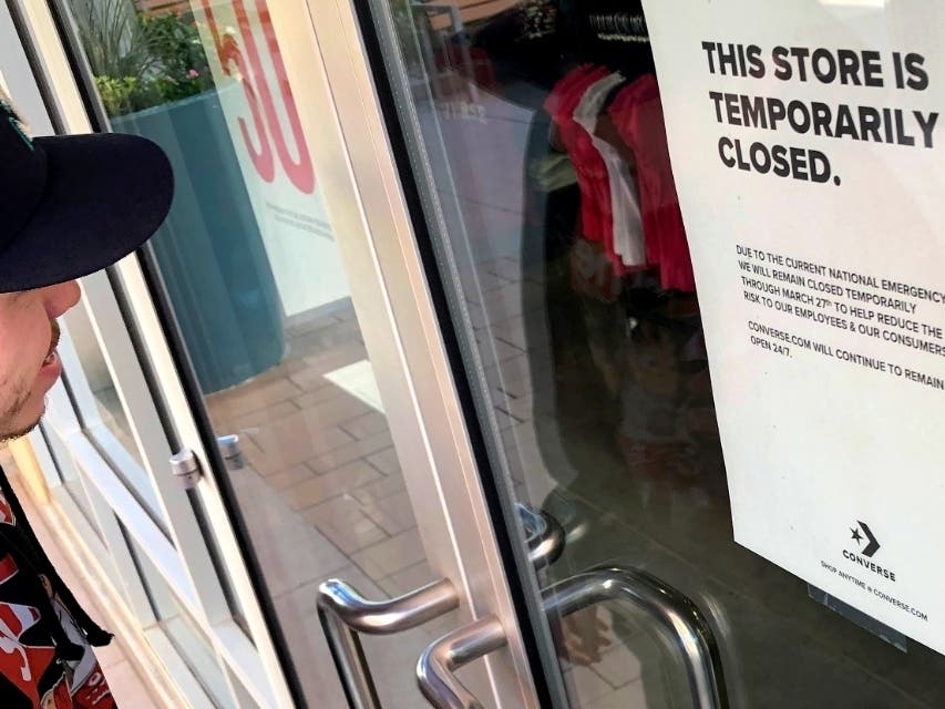 Businesses like this Converse store in Phoenix are closed under social distancing measures intended to slow the spread of the new coronavirus. Arizona Gov. Doug Ducey says the stay-at-home order could be scaled back by April 30 if it is safe to do so.