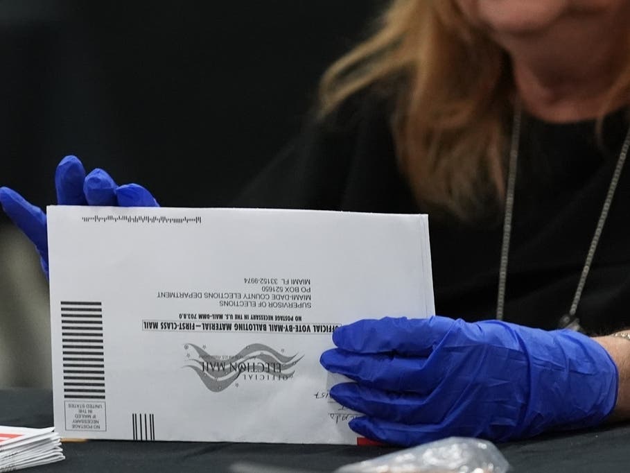 An election worker in Doral, Florida,sorts vote-by-mail ballots at the Miami-Dade County Supervisor of Elections Office for the state’s primary election on Tuesday, Aug. 18.