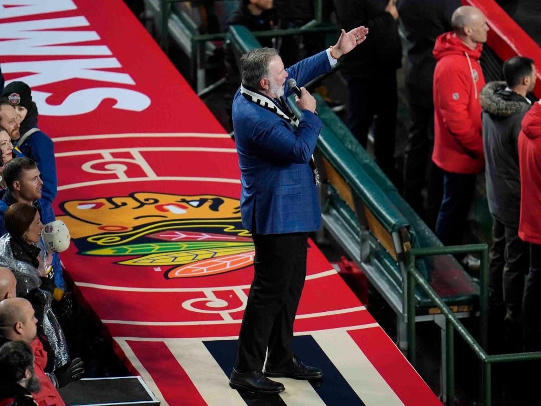 Chicago Blackhawks national anthem singer Jim Cornelison sings the Star-Spangled banner before the NHL Winter Classic outdoor hockey game featuring the Blackhawks and St. Louis Blues at Wrigley Field, Tuesday, Dec. 31, 2024, in Chicago.
