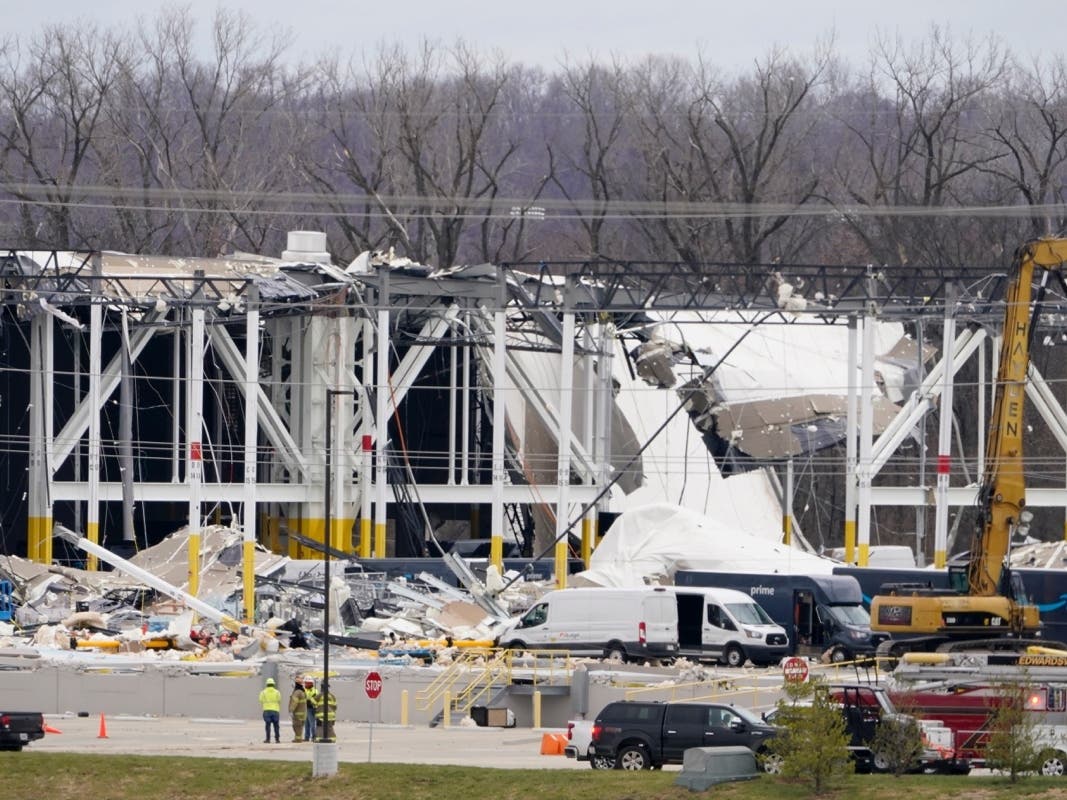 A heavily damaged Amazon fulfillment center is seen Dec. 11 in Edwardsville, Ill. A large section of the roof of the building was ripped off and walls collapsed when strong storms moved through area.