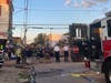 This photo provided by the Philadelphia Fire Department shows emergency personnel respond to the scene of a building that caught fire then collapsed early Saturday, June 18, 2022, in Philadelphia.