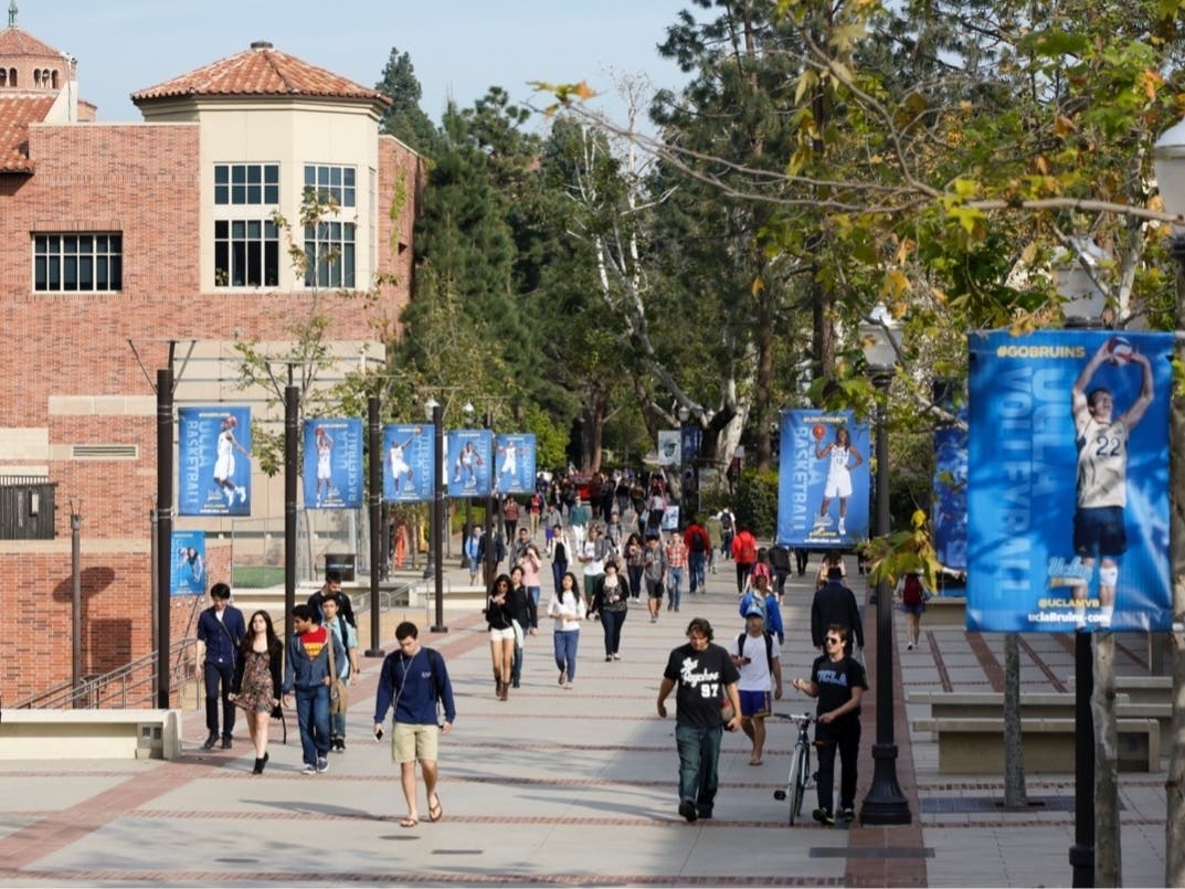 In this Feb. 26, 2015, file photo, students walk on the UCLA campus in Los Angeles. 