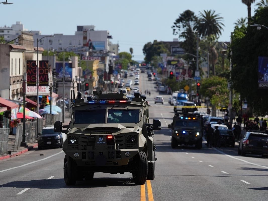 Law enforcement vehicles are seen near MacArthur Park after federal authorities made arrests on charges related to the selling of illicit drugs on Wednesday, May 6, 2026, in Los Angeles.