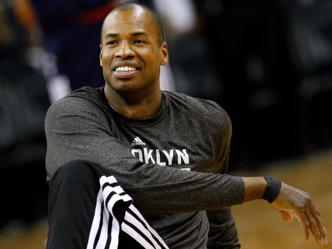 Brooklyn Nets center Jason Collins warms up before an NBA basketball game in New Orleans, March 24, 2014.
