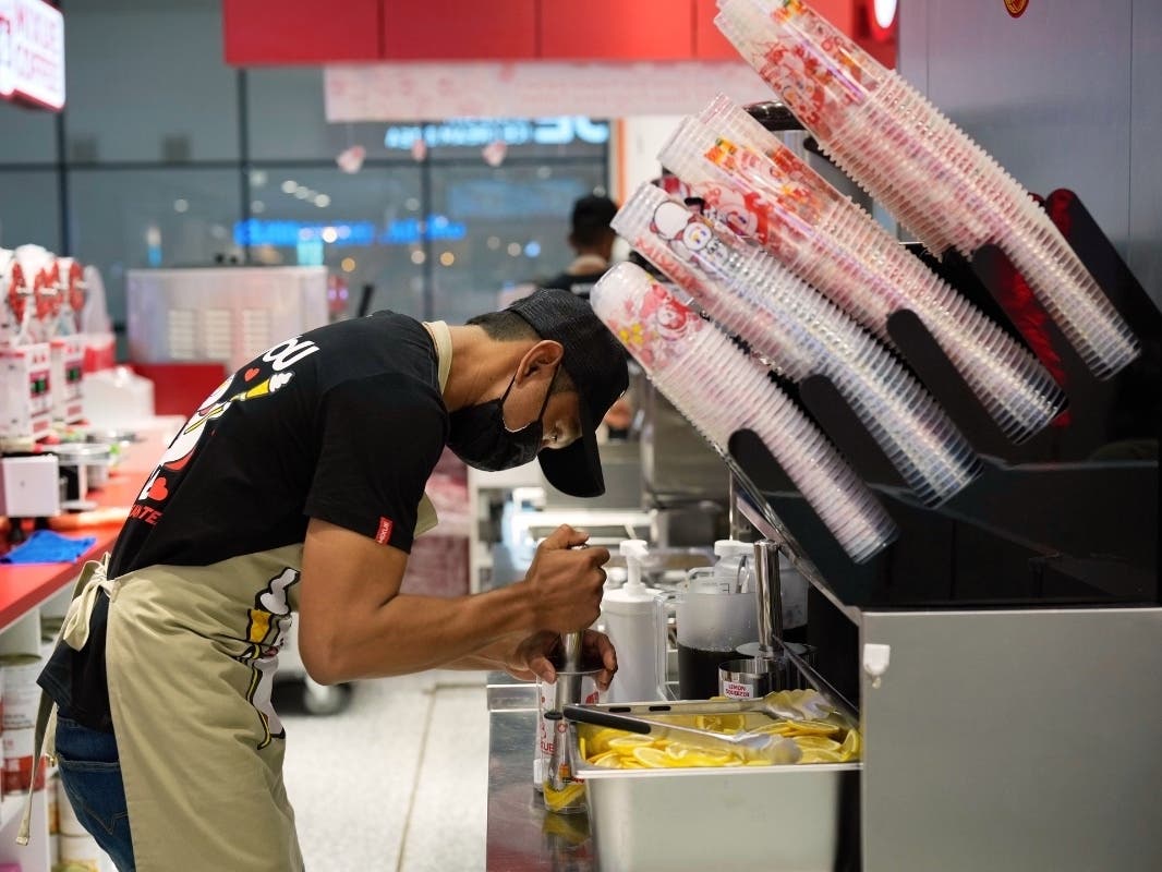 A Mixue outlet staffer prepares a drink for a customer at a shopping outlet in Sepang, Malaysia, Thursday, March 25, 2025.