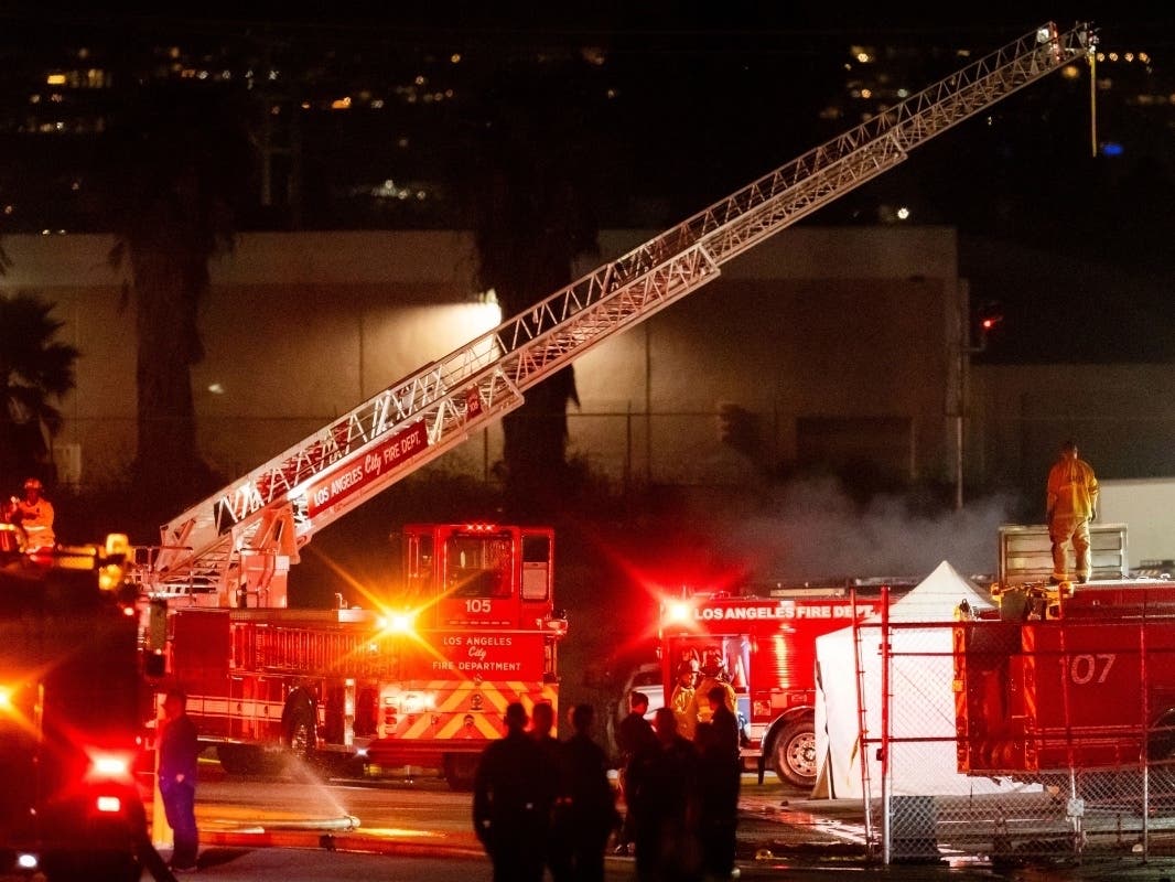 First responders work the scene after a helicopter crashed near a bus crash in Chatsworth, a neighborhood in Los Angeles, Tuesday, Sept. 15, 2026.