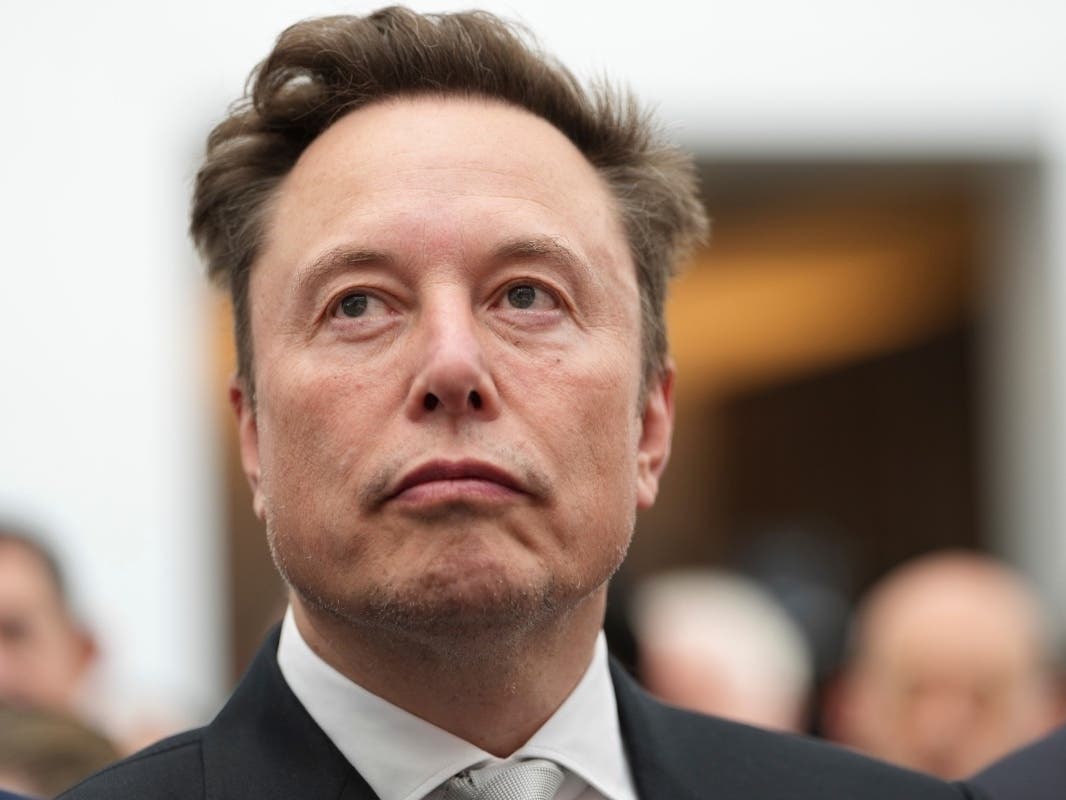 Elon Musk listens as President Donald Trump speaks during an event at the U.S. Institute of Peace, Oct. 8, 2026, in Washington.