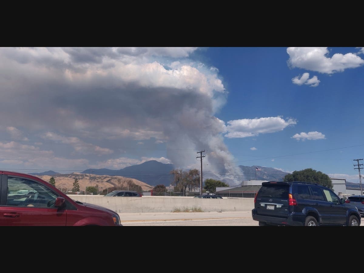 A plume of smoke from the El Dorado Fire is seen from the Interstate 10 in Loma Linda, Calif., Saturday, Sept. 5, 2020. 