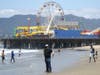 A man wears a face mask and gloves on Santa Monica beach on the day Los Angeles County reopened its beaches, which had been closed due the coronavirus pandemic, on May 13.