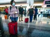 Passengers wait to board an American Airlines flight to Charlotte, North Carolina at San Diego International Airport on May 20, 2020 in San Diego.