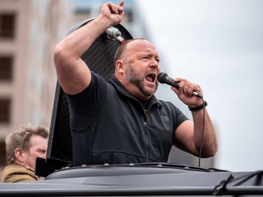 Infowars host Alex Jones, seen here at a protest at the Texas State Capitol against coronavirus stay-at-home orders, was found guilty in a Connecticut court Monday in four defamation cases filed by families of victims from the Sandy Hook mass shooting.