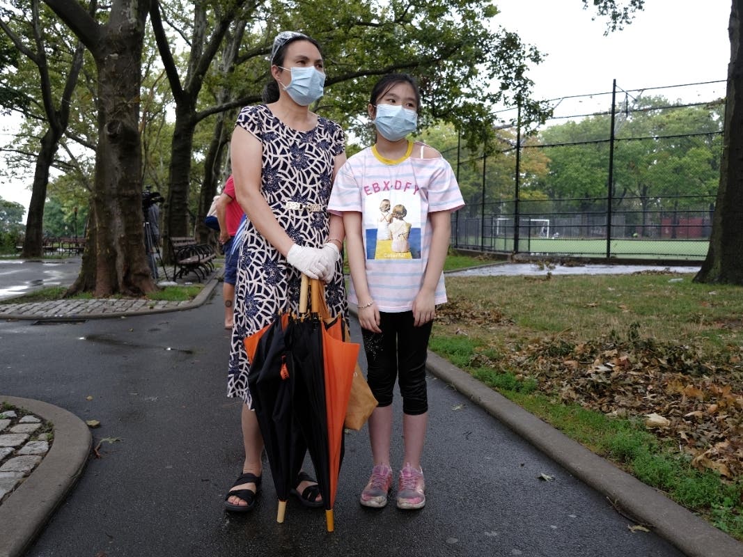 A mother and daughter line-up to take a Covid-19 test in the Sunset Park neighborhood of New York City, which has seen a spike in coronavirus cases in recent days.