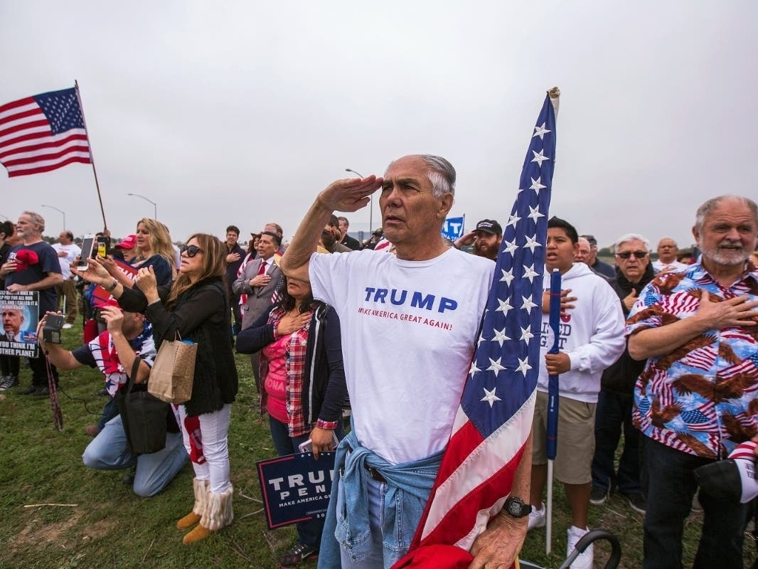 Pro-Donald Trump activists hold a rally supporting the president and his immigration policies.