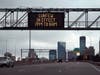 A sign above an interstate warns residents and visitors Monday of a curfew put in place in an attempt to curtail violence in Minneapolis, Minnesota.