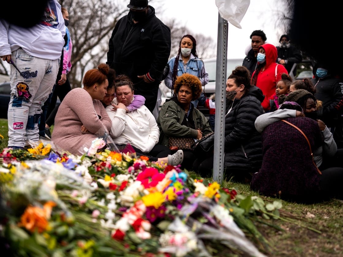 Members of Daunte Wright's family visit a memorial site near the place he was killed on April 14, 2021 in Brooklyn Center, Minnesota. 