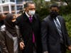 Ilhan Omar (D-MN) (L) walks with Rev. Jesse Jackson outside the Hennepin County Government Center on April 19, 2021 in Minneapolis, Minnesota.