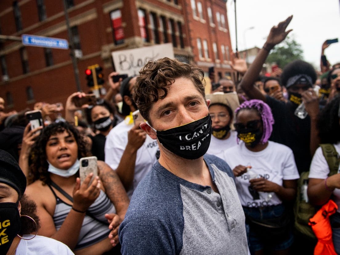 Minneapolis Mayor Jacob Frey leaves after coming out of his home to speak during a demonstration calling for the Minneapolis Police Department to be defunded on June 6, 2020 in Minneapolis, Minnesota.