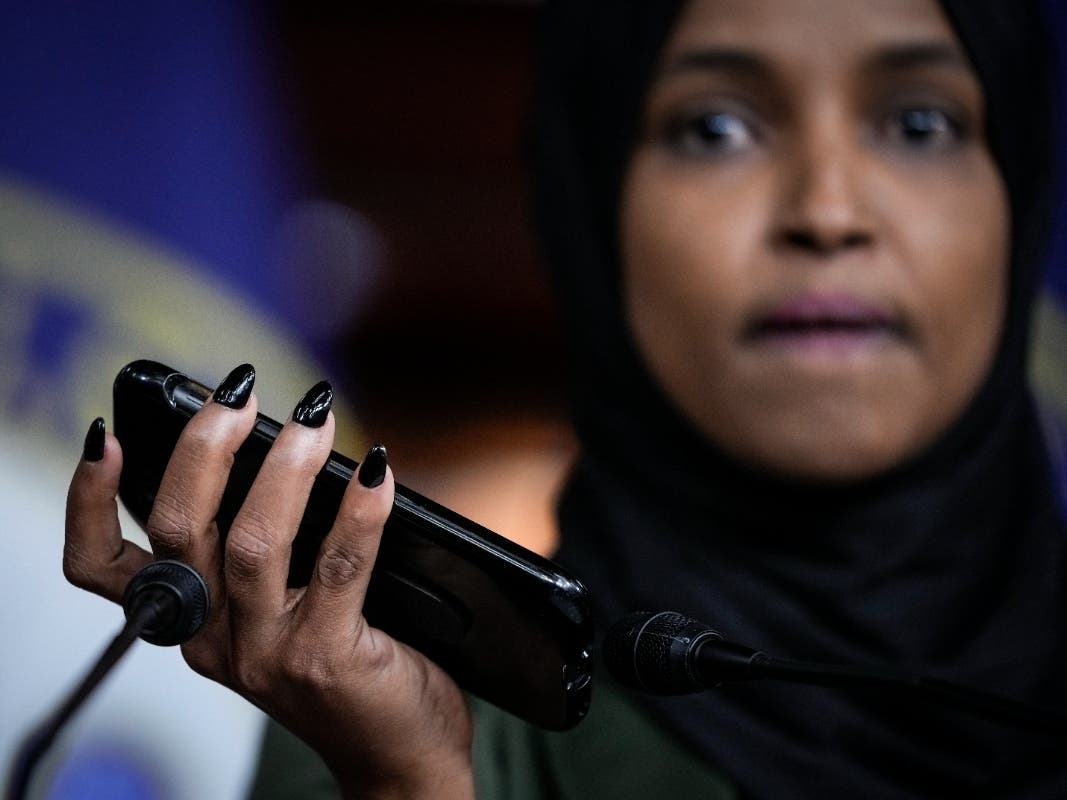 Rep. Ilhan Omar (D-MN) plays a voicemail containing a death threat during a news conference about Islamophobia on Capitol Hill on November 30, 2021 in Washington, DC. 