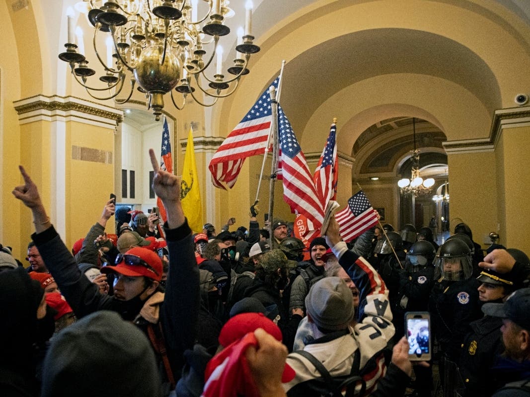Supporters of US President Donald Trump protest inside the US Capitol on January 6, 2021, in Washington, DC. - Demonstrators breeched security and entered the Capitol as Congress debated the 2020 presidential election Electoral Vote Certification. 