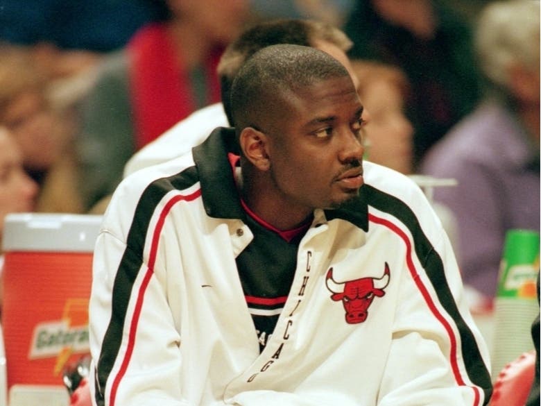 Corey Benjamin #25 of the Chicago Bulls in 1999, now apologizes to a family for his daughter's actions on the court after punching a player at her mother's insistence. 