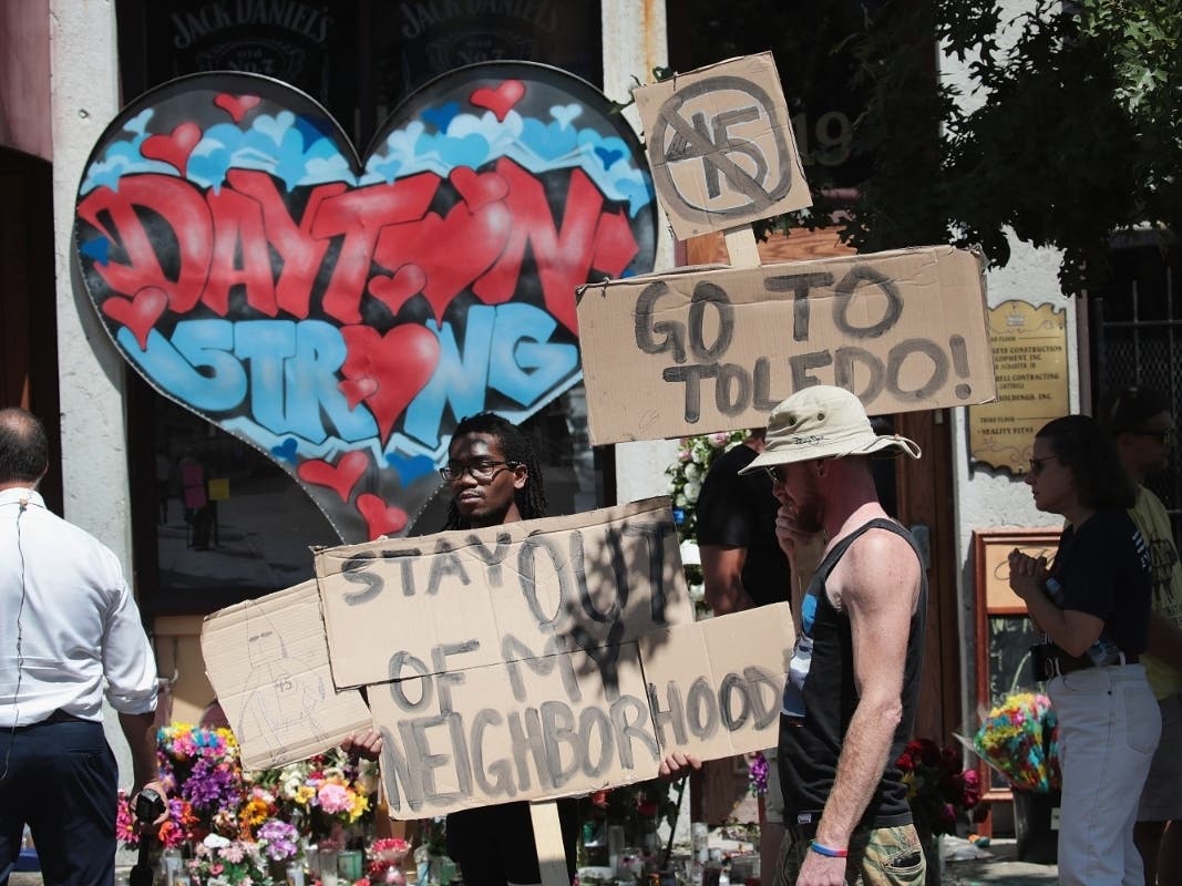 Protesters organized in the Oregon District and throughout Dayton during the president's visit on Wednesday. 