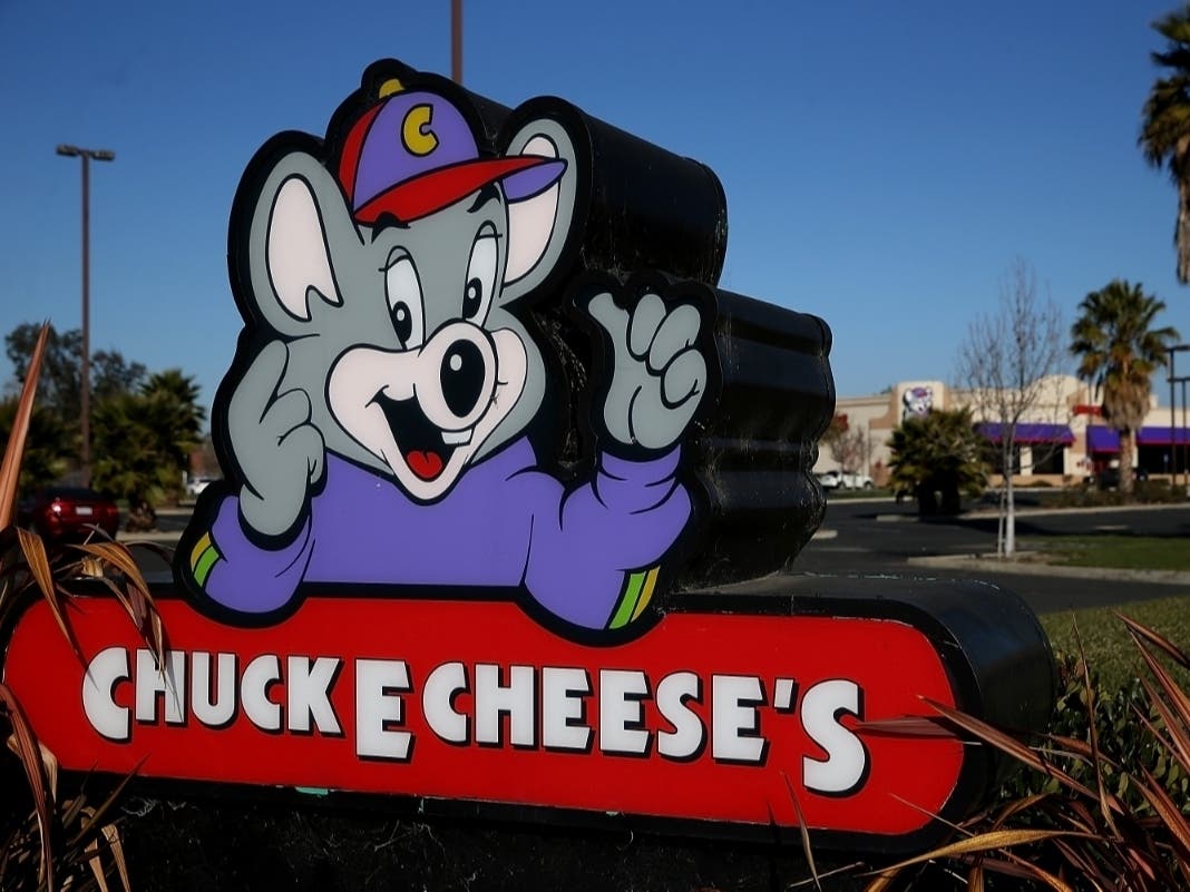 A sign is posted in front of a Chuck E. Cheese restaurant on January 16, 2014 in Newark, California.